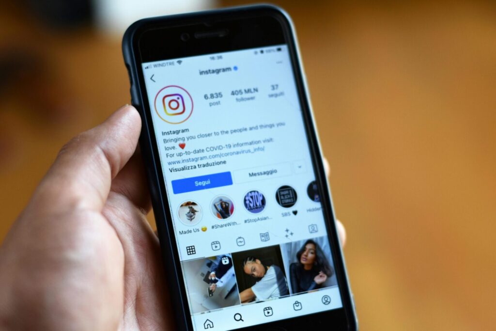 Close-up of a smartphone displaying an Instagram profile screen.