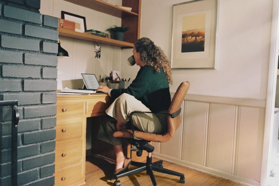 Woman working at desk with coffee